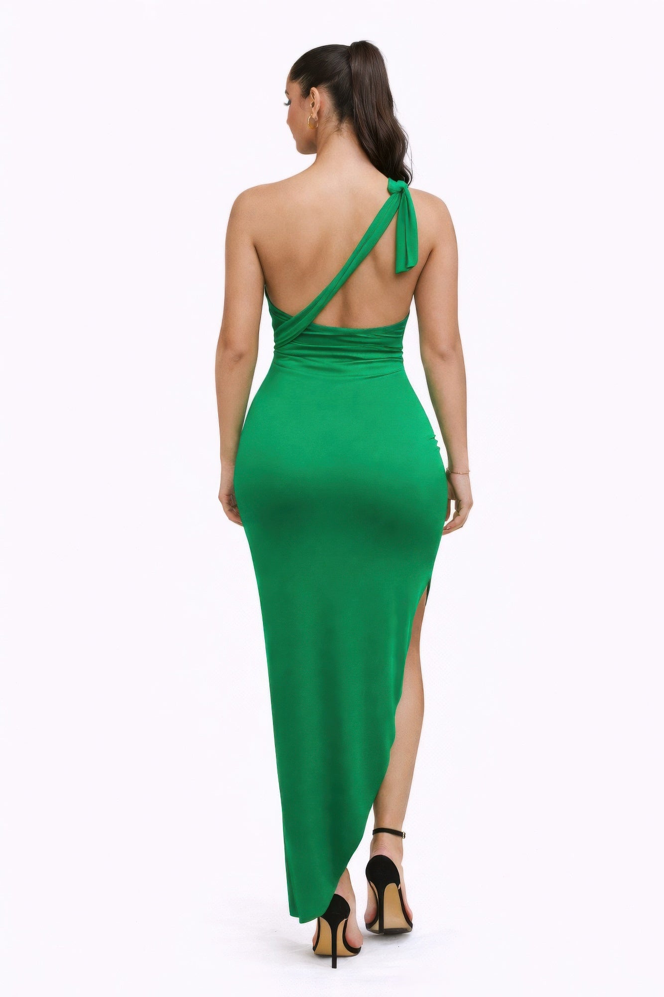 Back view of a woman wearing the bold statements dress in green, showcasing its elegant silhouette and multiway neckline.