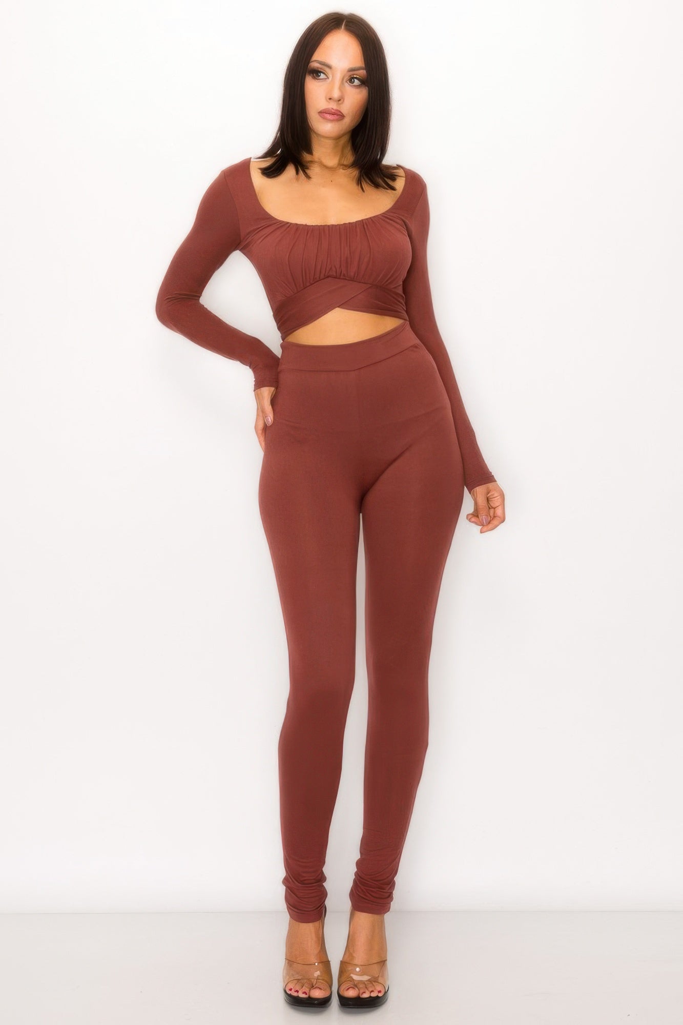 Tie back cutout jumpsuit showcasing a sleek design with fitted legs and a stylish front cutout detail.