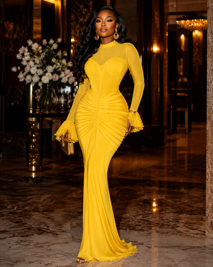 Sculpted yellow mermaid maxi dress with ruched long sleeves, featuring a fitted silhouette and dramatic trumpet hem.