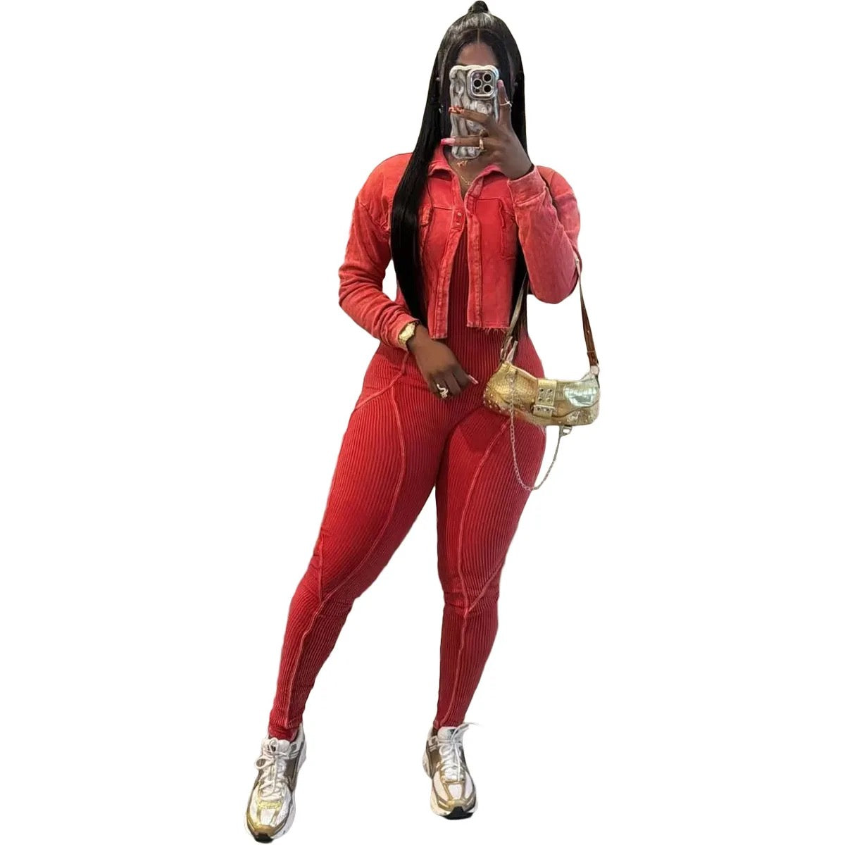 Person wearing a red outfit with gold shoes and a handbag on a white background