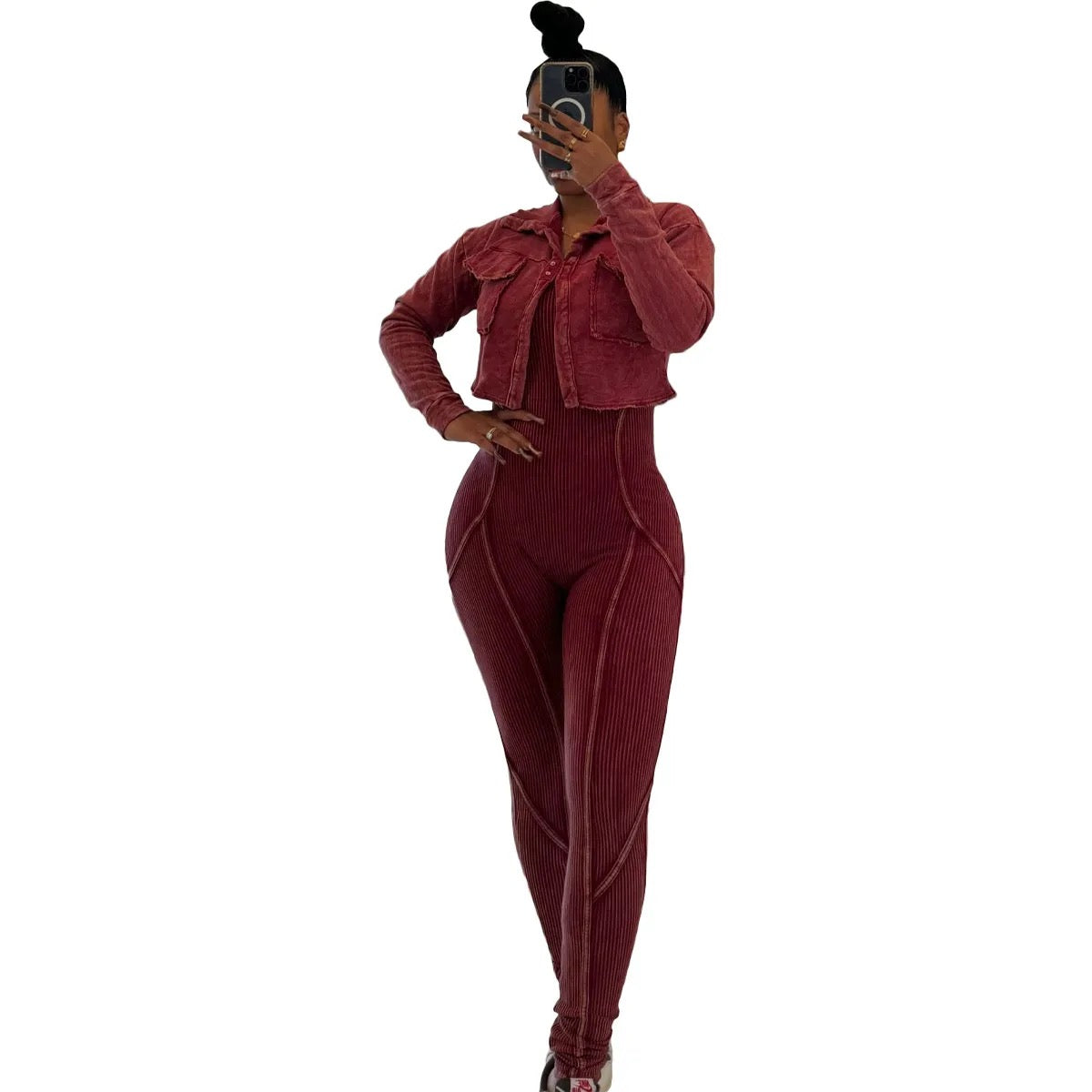 Person wearing a burgundy outfit on a white background