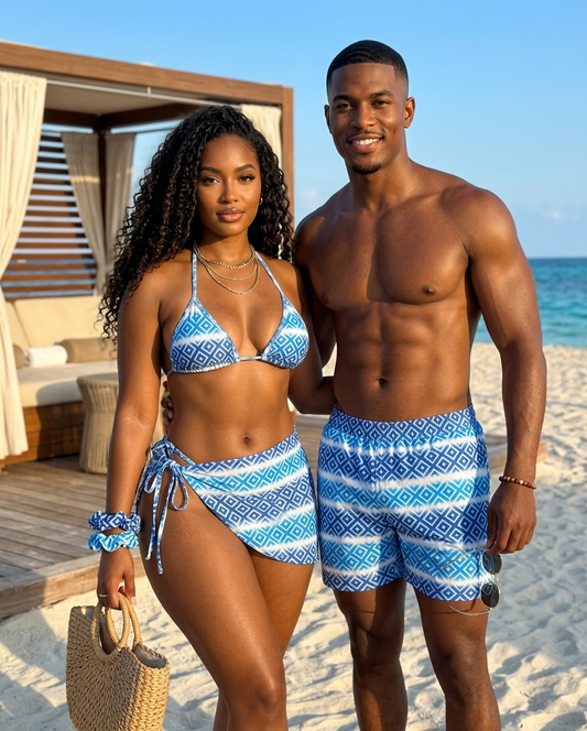 Couple in matching swimwear for couples at the beach, featuring vibrant blue patterns, perfect for vacation vibes.