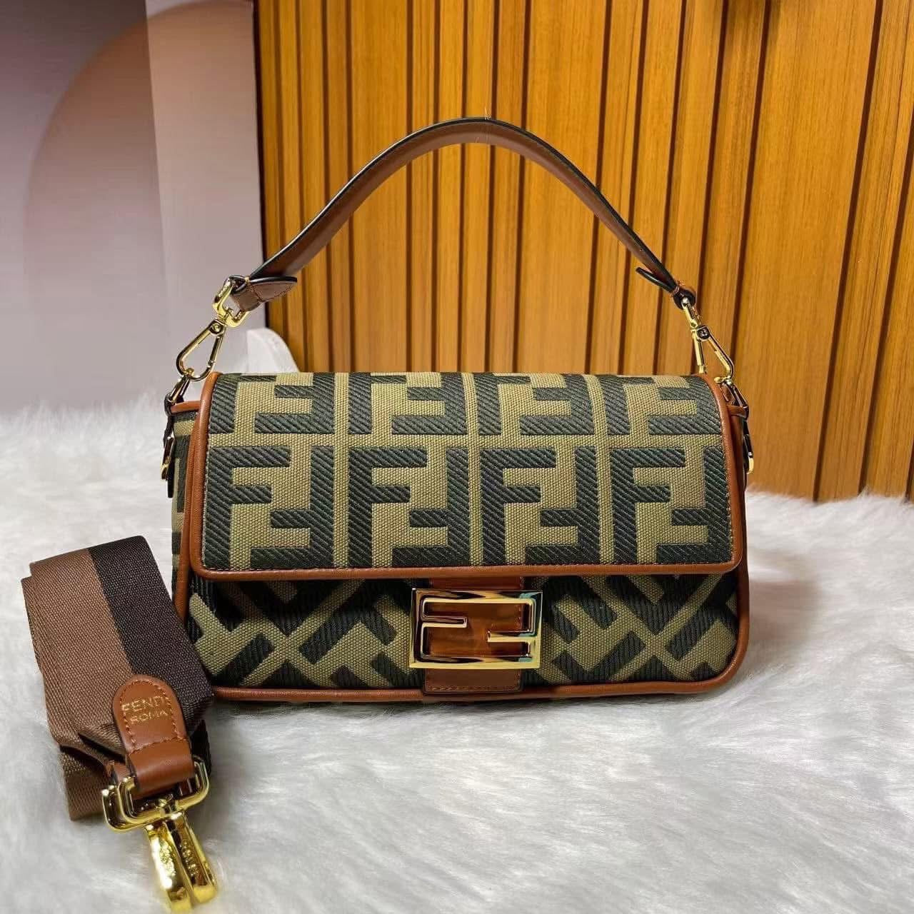 Designer handbag with brand logo on a white surface with wooden background