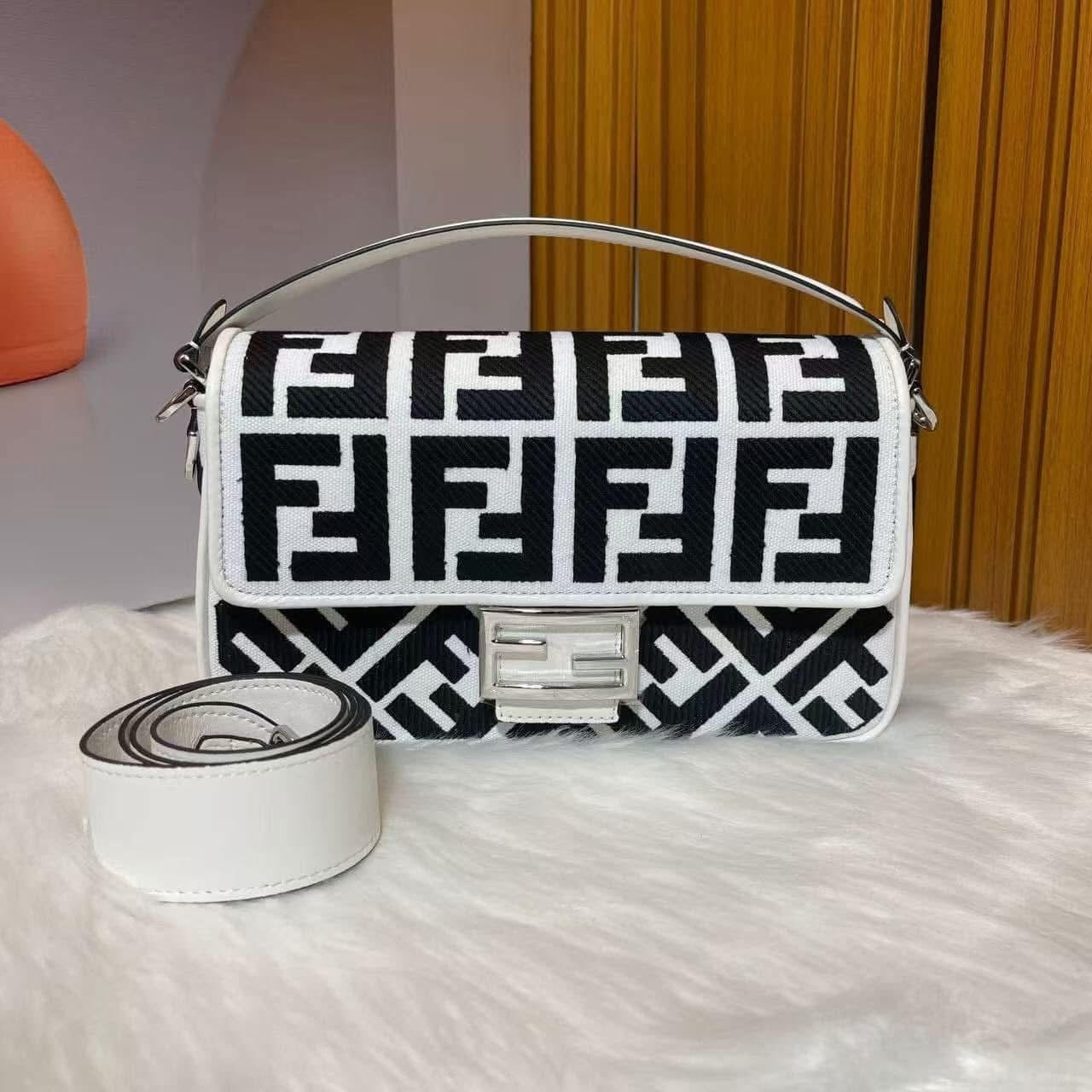 Designer handbag with distinctive pattern on a textured surface