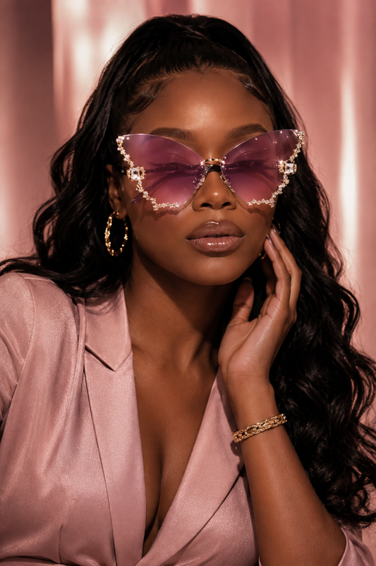 Rimless butterfly-shaped sunglasses by Rose In Concrete featuring clear lenses and a modern, stylish design.