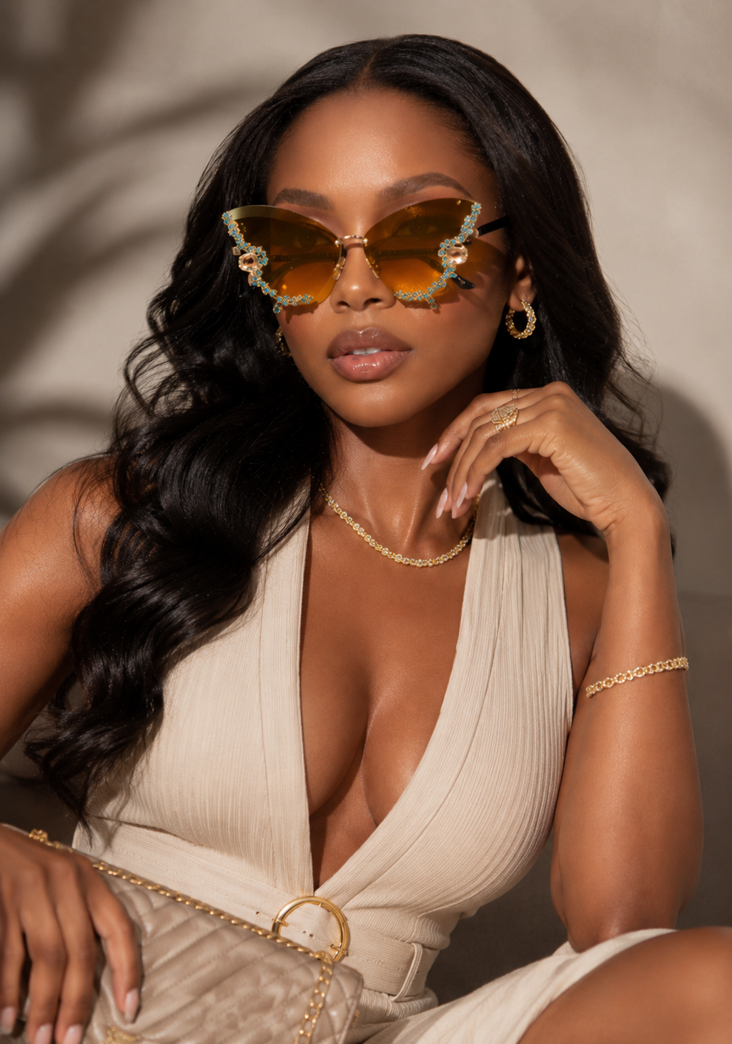 Rimless butterfly sunglasses by Rose In Concrete featuring clear lenses and a sleek, modern design.