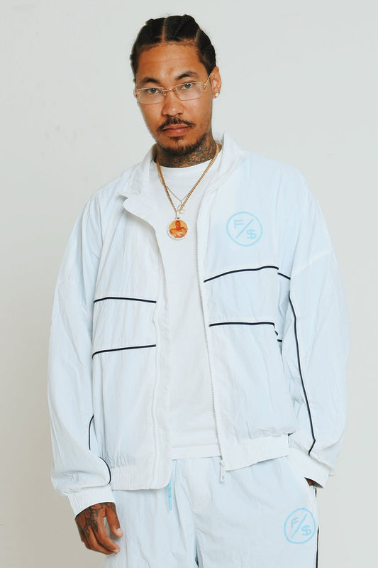 Lightweight utility windbreaker jacket worn by model, showcasing full zip design and modern streetwear style.