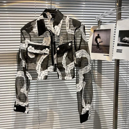 Transparent mesh crop jacket with turn-down collar and lantern sleeves, featuring a unique black and white design.