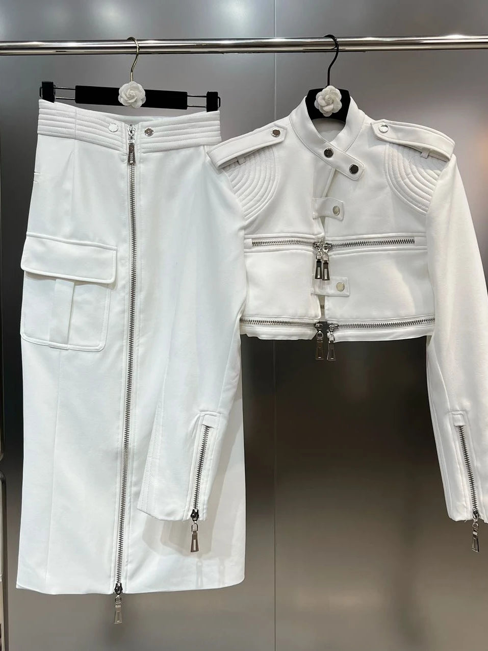 Structured moto jacket cargo skirt set in white, showcasing edgy style and high functionality, perfect for streetwear.