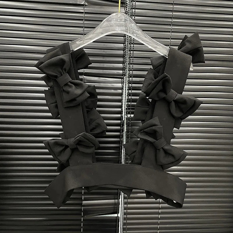 Bow Cascade Statement Crop Top featuring layered 3D bows, perfect for stylish and bold fashion moments.