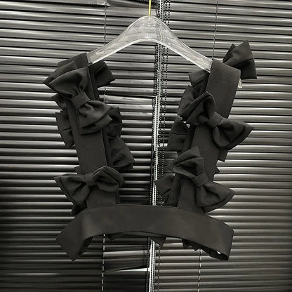 Bow Cascade Statement Crop Top featuring layered 3D bows, perfect for stylish and bold fashion moments.