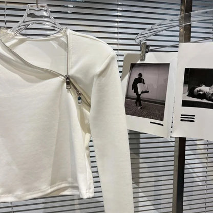 Alt Tag: Asymmetric Zip Sculpt Long-Sleeve Top – Minimalist Streetwear Cutout Tee in white with diagonal zipper, modern neckline, long sleeves