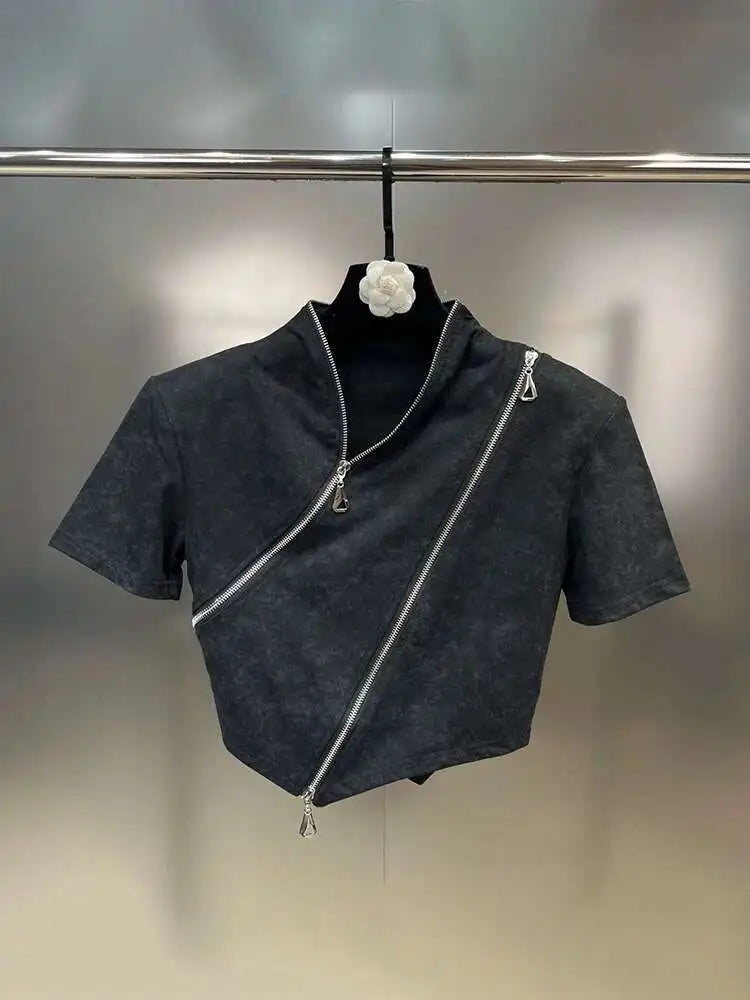 Asymmetrical zip crop top featuring a stonewashed finish, sculpted hem, and bold diagonal zipper for edgy streetwear style.