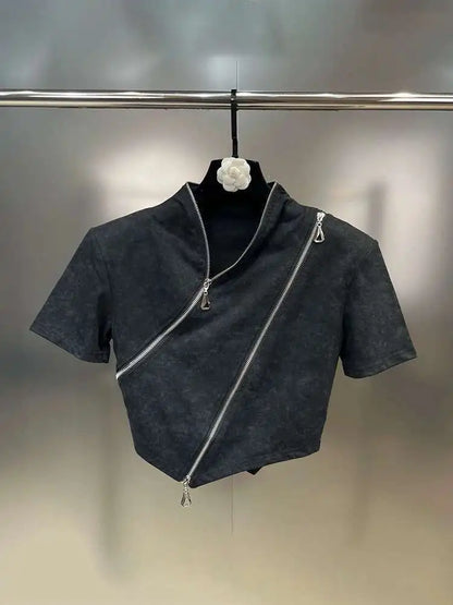 Asymmetrical zip crop top featuring a stonewashed finish, sculpted hem, and bold diagonal zipper for edgy streetwear style.