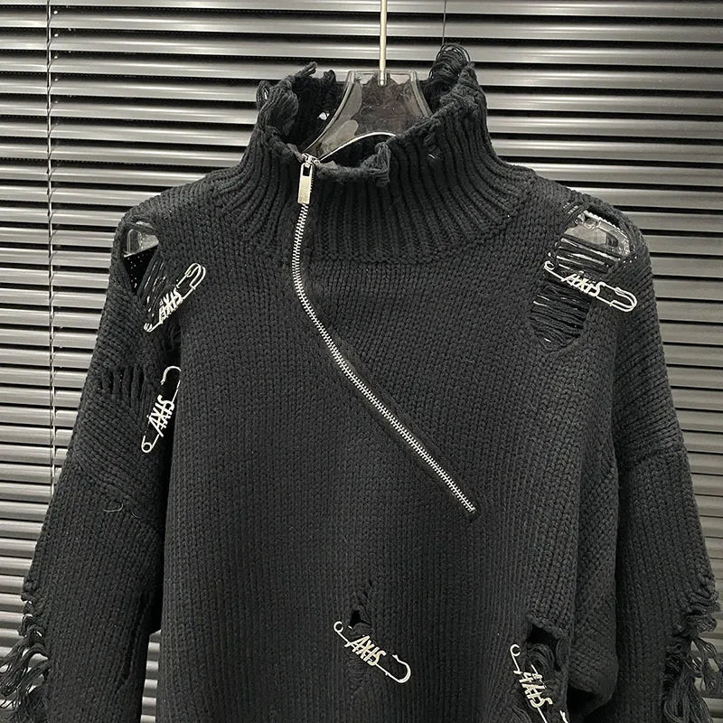 Alt Tag: Distressed Half-Zip High Collar Knit Sweater in black with shredded detailing, oversized fit, asymmetrical zip and safety pins