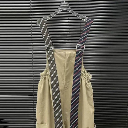 Alt Tag: Executive Street Suspender Jumpsuit with detachable tie-style suspenders on hanger, high-waist wide-leg silhouette in beige polyester