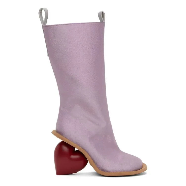 Heartbreak Heeled Mid-Calf Boots in lilac microfiber leather with sculptural curved heart heel, women’s fashion statement boot side view