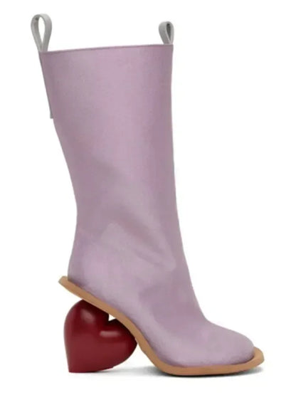 Heartbreak Heeled Mid-Calf Boots in lavender microfiber leather with sculptural red heart-shaped curved heel, side view
