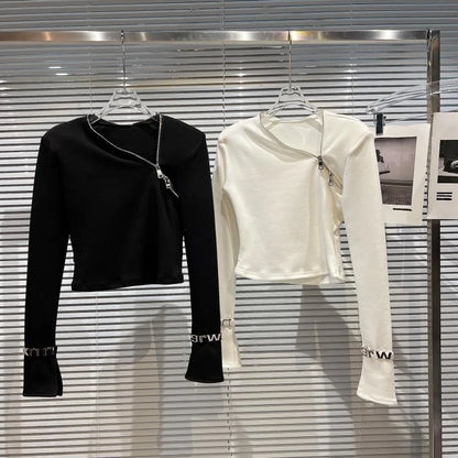 Alt Tag: Asymmetric Zip Sculpt Long-Sleeve Top – Minimalist Streetwear Cutout Tee in black and white, diagonal zip long-sleeve tops on hangers