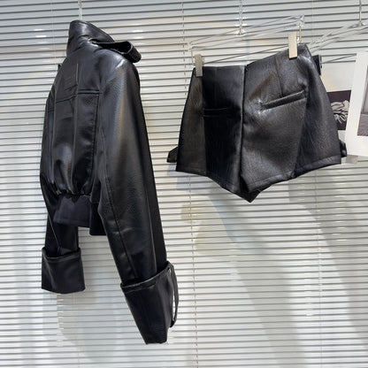 faux leather mini set with jacket and shorts showcasing the cropped moto-style jacket and high-waist shorts.