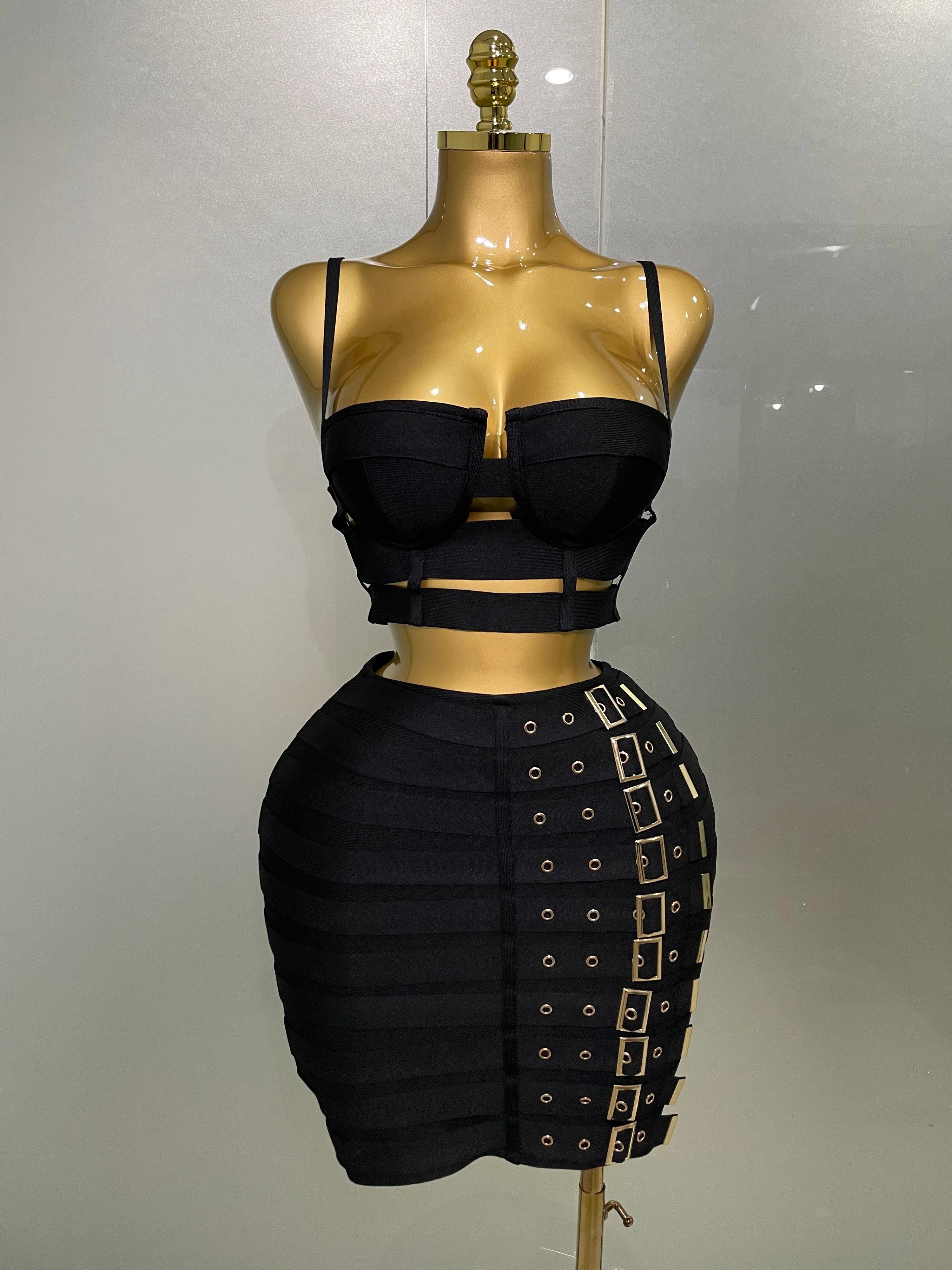 Sculpted Buckle Bandage 2-Piece Set black bustier crop top and buckle bandage skirt on mannequin, sculpted fit with luxe stretch