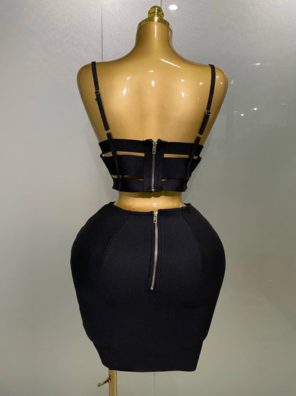 Alt Tag: Sculpted Buckle Bandage 2-Piece Set black bandage bustier crop top and high-waist skirt back view on mannequin