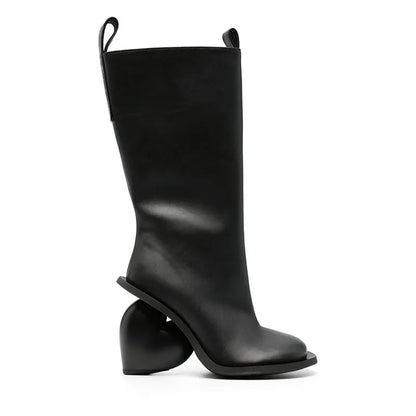 Alt Tag: Heartbreak Heeled Mid-Calf Boots in black microfiber leather with sculptural curved heart heel, side profile women’s fashion boot