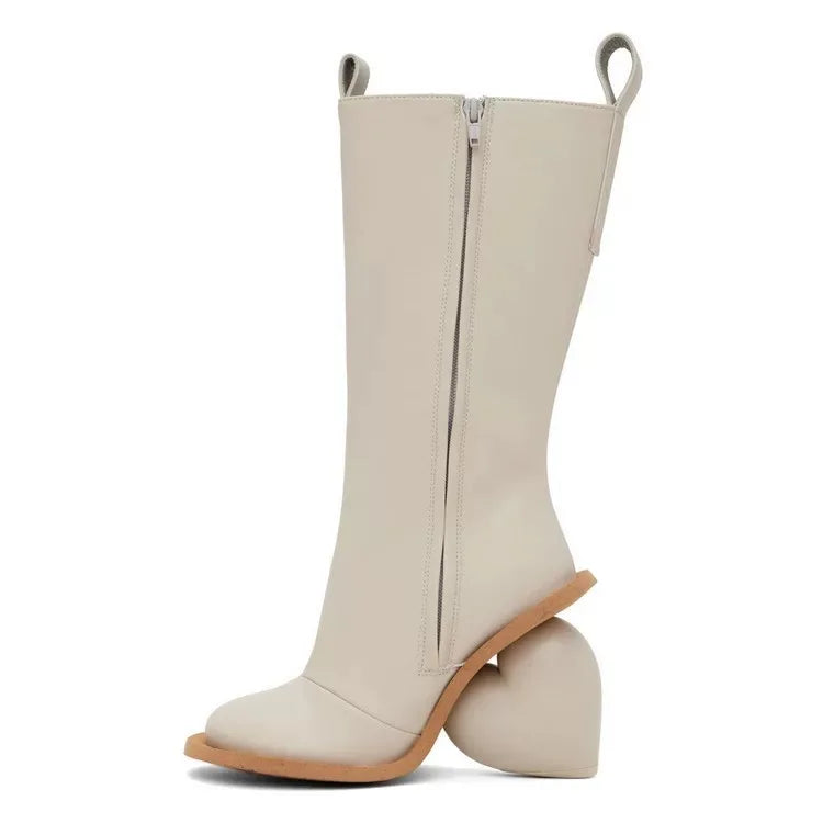 Heartbreak Heeled Mid-Calf Boots in cream microfiber leather with curved heart heel, side zip, and sculptural runway silhouette