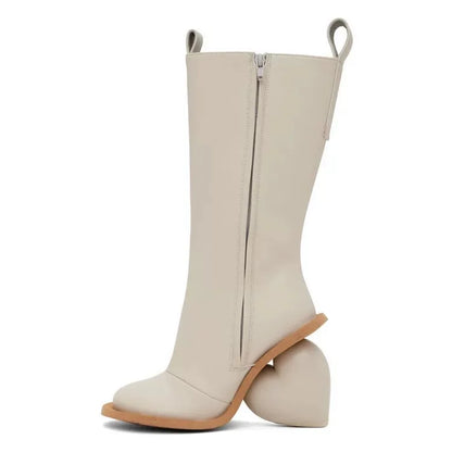 Heartbreak Heeled Mid-Calf Boots in cream microfiber leather with curved heart heel, side zip, and sculptural runway silhouette