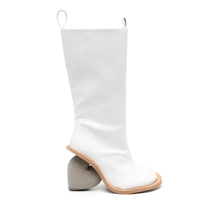 Alt Tag: Heartbreak Heeled Mid-Calf Boots in white microfiber leather with sculptural curved heart heel, runway-inspired women’s statement boots