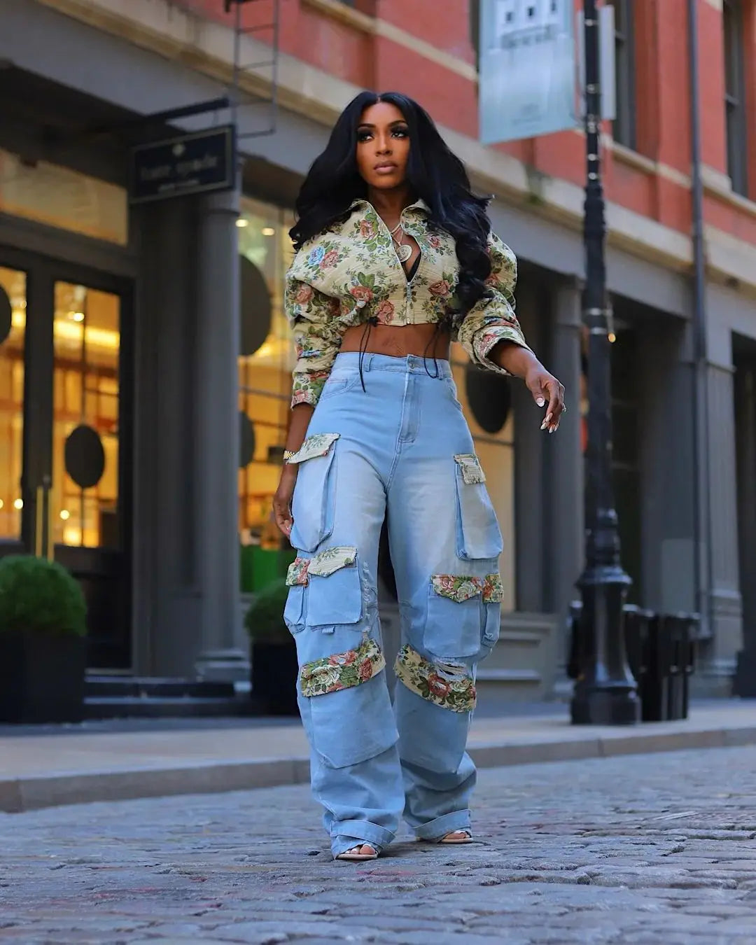 Floral Bomber Crop Jacket & Cargo Patchwork Wide-Leg Jean Set on model wearing floral cropped bomber and high-waisted wide-leg cargo jeans