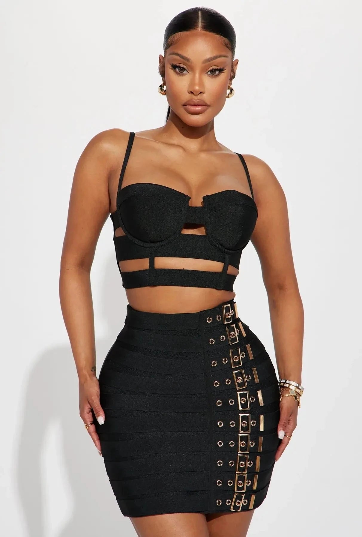 Sculpted Buckle Bandage 2-Piece Set black bustier crop top with cutout straps and buckle mini skirt, figure-sculpting bandage fit