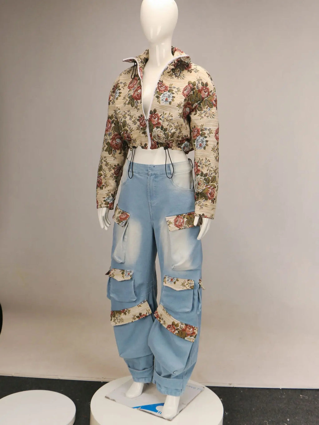 Floral Bomber Crop Jacket & Cargo Patchwork Wide-Leg Jean Set showcasing floral bomber jacket and cargo jeans set on mannequin.