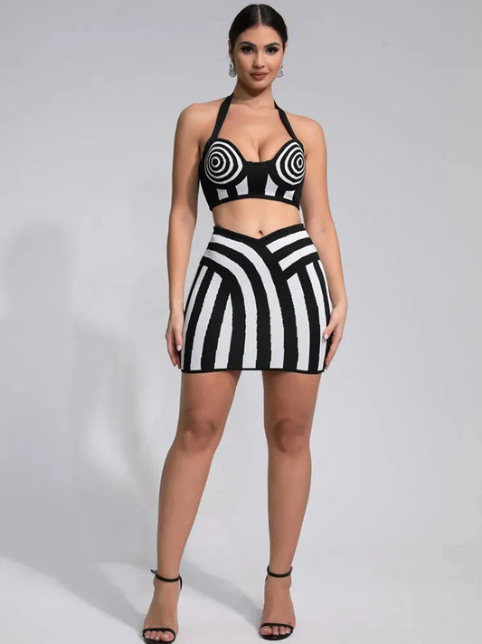Optical illusion bandage set featuring a halter top and fitted skirt in striking black-and-white patterns.