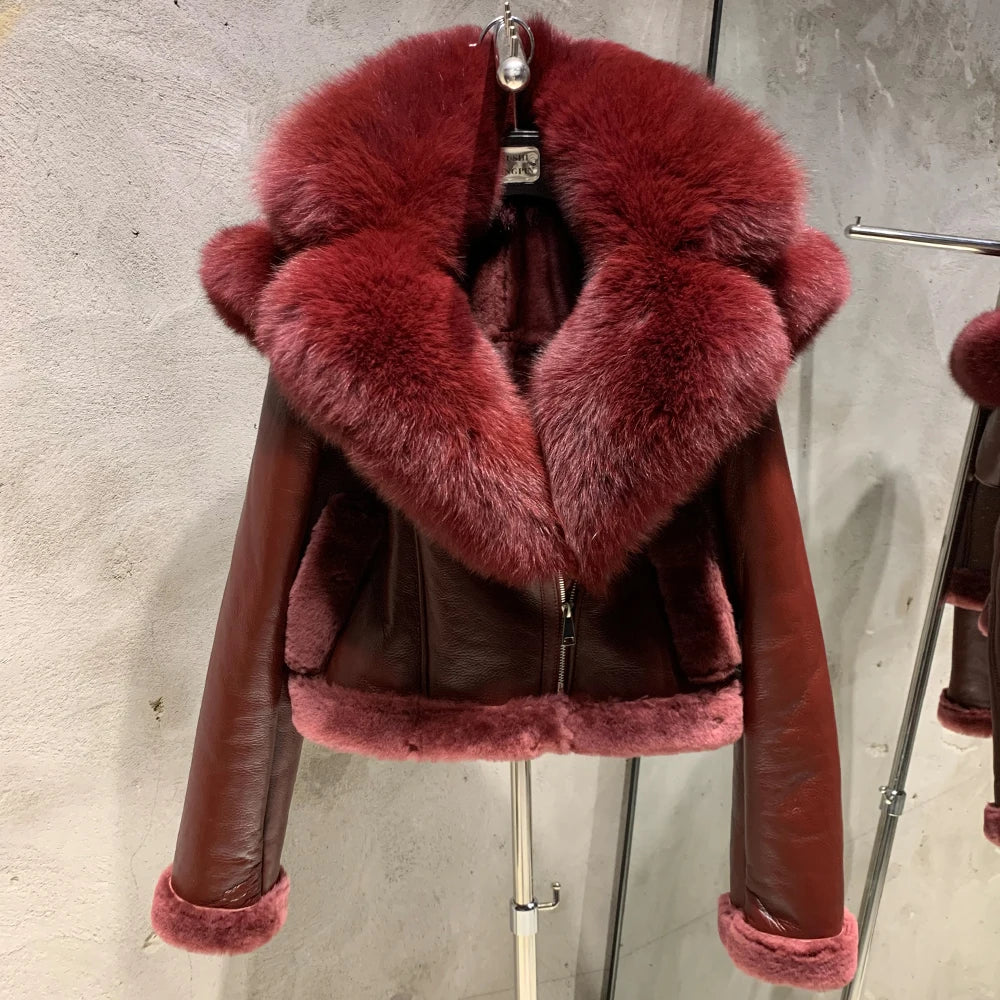 Shearling fur collar leather jacket in rich burgundy with oversized fur collar and zipper front.