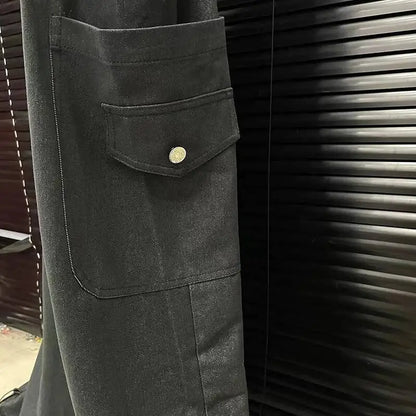 Alt Tag: Executive Street Suspender Jumpsuit black wide-leg pant detail with flap pocket and button, high-waist tailored streetwear style