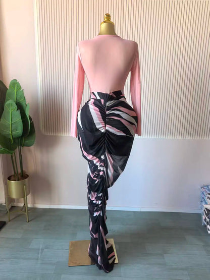 Alt Tag: Sculpted Mirage Draped Maxi Dress on mannequin, back view, fitted knit top with long sleeves and abstract draped skirt