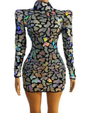 Galaxy Armor Holographic Mini Dress with sculpted shoulders, long sleeves, high-shine reflective appliqués, and waist-snatching fit