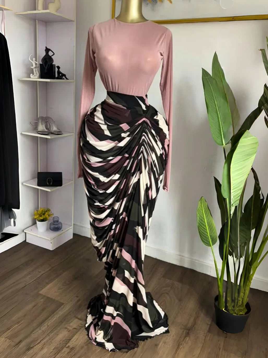 Sculpted Mirage Draped Maxi Dress featuring sculpted pleats and a fitted top in a stylish display.