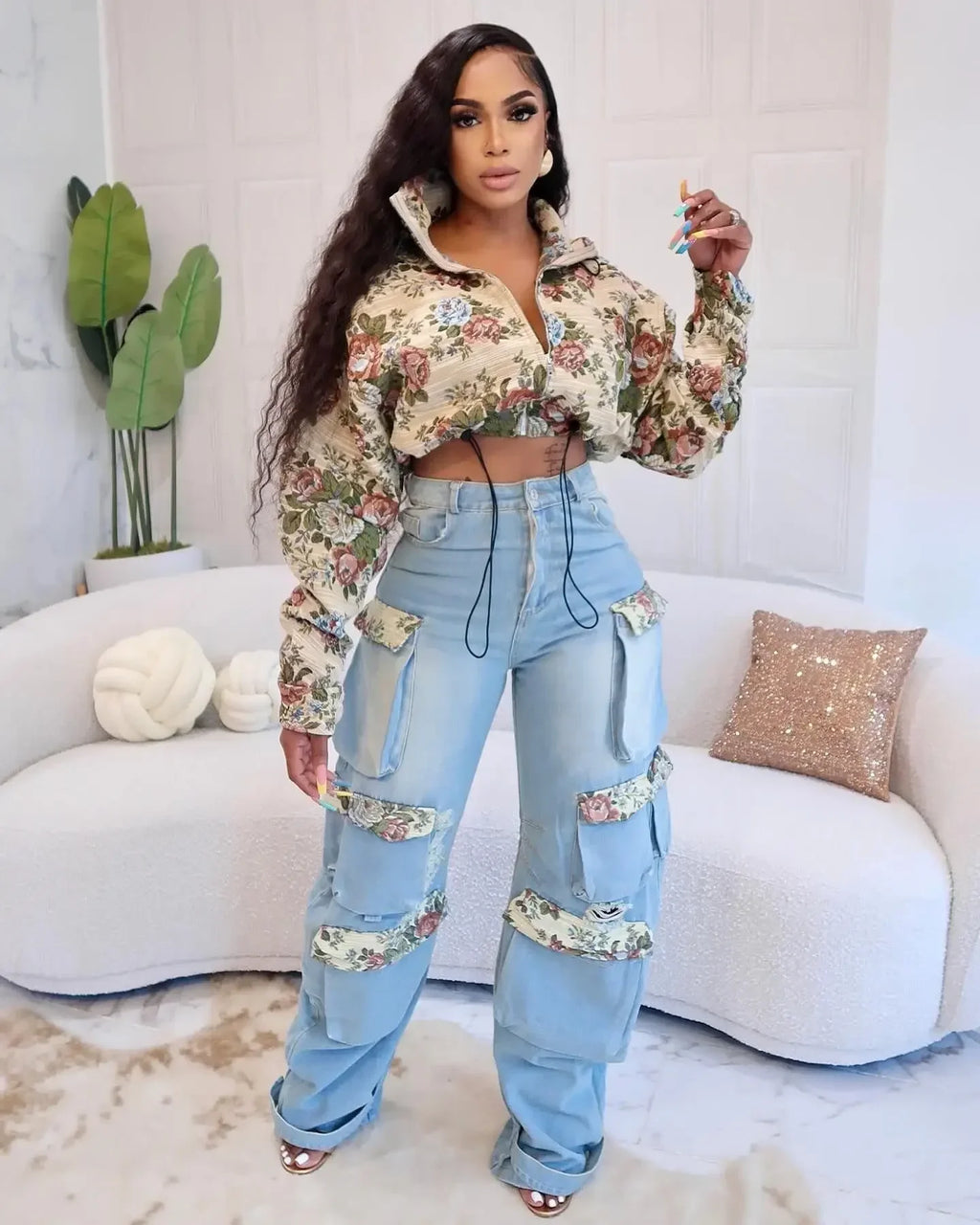 Floral bomber jacket and cargo jeans set model showcasing a trendy, feminine outfit with floral design and wide-leg denim.