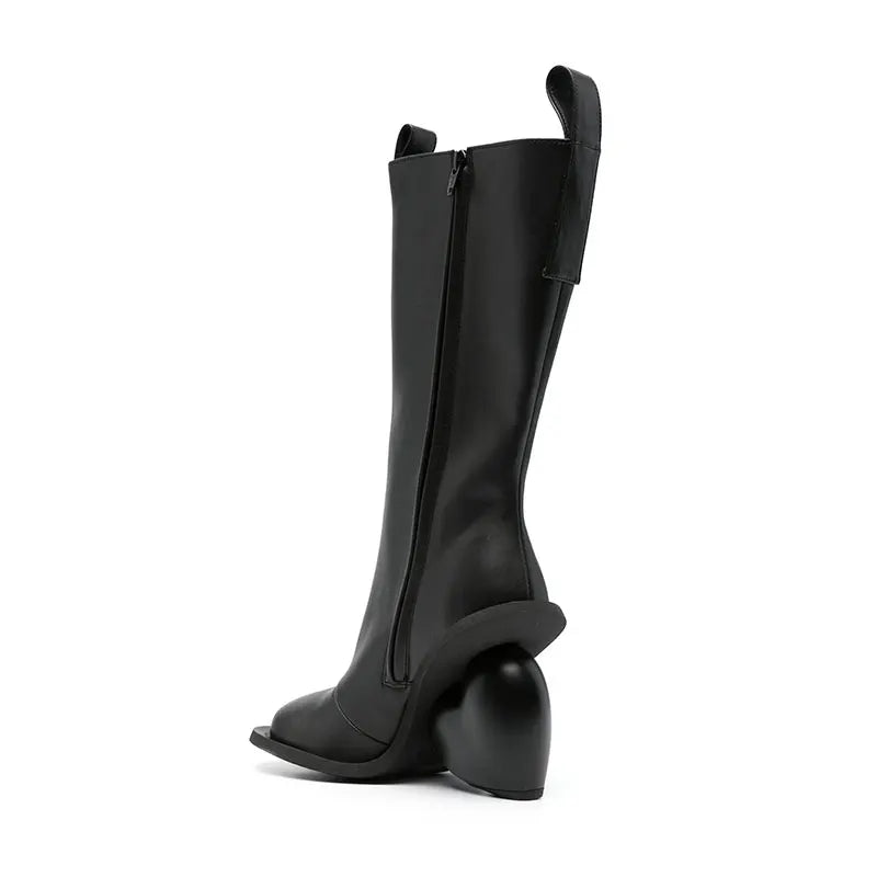 Alt Tag: Heartbreak Heeled Mid-Calf Boots in black microfiber leather with curved heart heel, side zip, runway-inspired women's statement boots