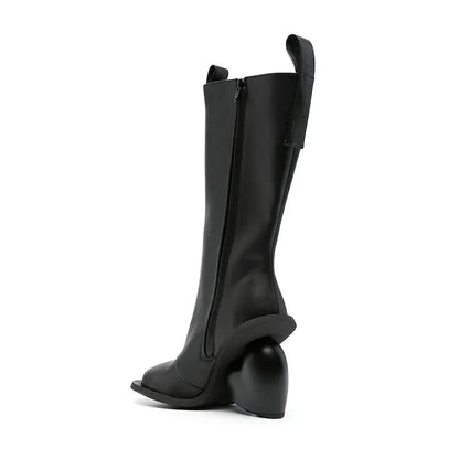 Alt Tag: Heartbreak Heeled Mid-Calf Boots in black microfiber leather with curved heart heel, side zip, runway-inspired women's statement boots