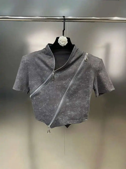Asymmetrical zip crop top featuring a stonewashed design and bold diagonal zipper for edgy streetwear style.