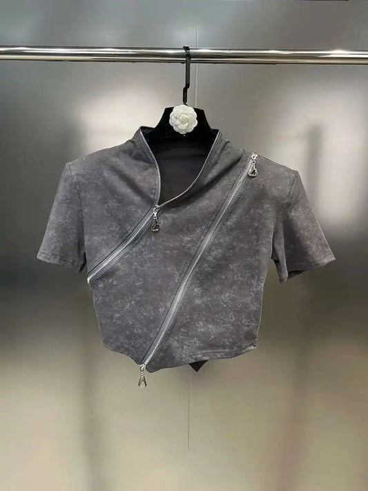 Asymmetrical zip crop top featuring a stonewashed design and bold diagonal zipper for edgy streetwear style.
