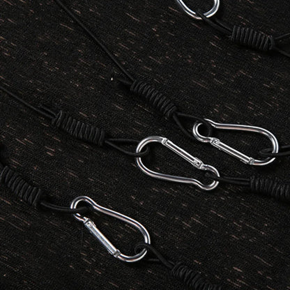 Close-up of silver-tone hardware details on the Black Safety-Pin Asymmetrical Bodycon Mini Dress.
