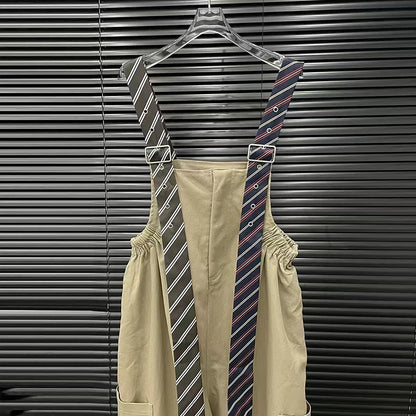 Executive Street Suspender Jumpsuit featuring stylish striped suspenders against a dark backdrop.