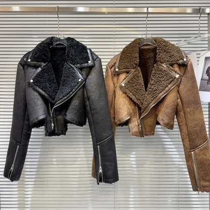 Two cropped faux-leather shearling moto jackets displayed, one black and one brown, showcasing winter style and bold design.