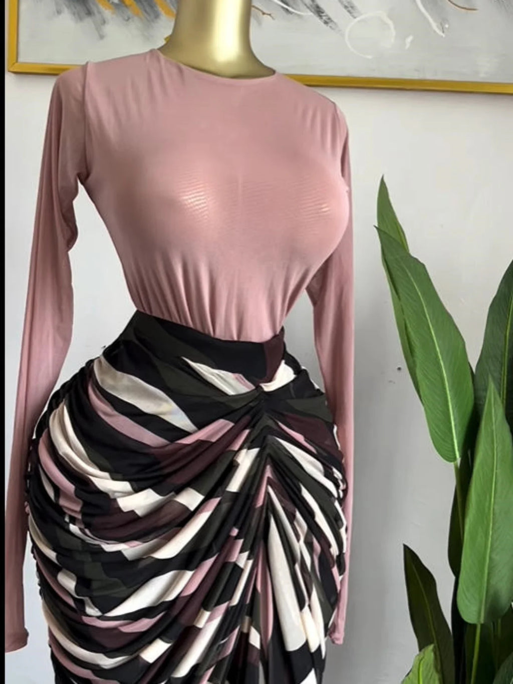 Sculpted Mirage Draped Maxi Dress featuring a fitted pink top and a dramatic, abstract printed draped maxi dress skirt.