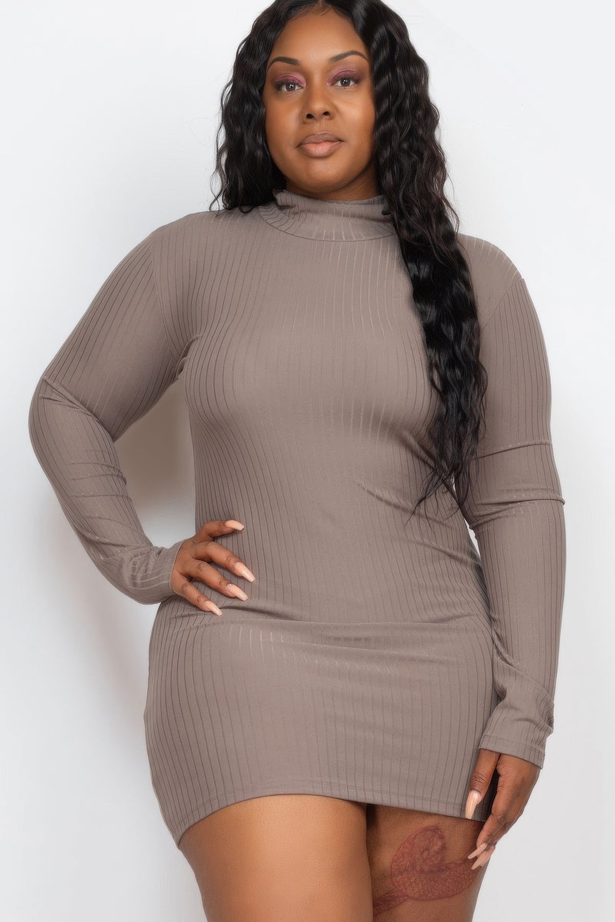 Plus size ribbed bodycon dress on a model featuring long sleeves and mock neck design, showcasing a flattering silhouette.