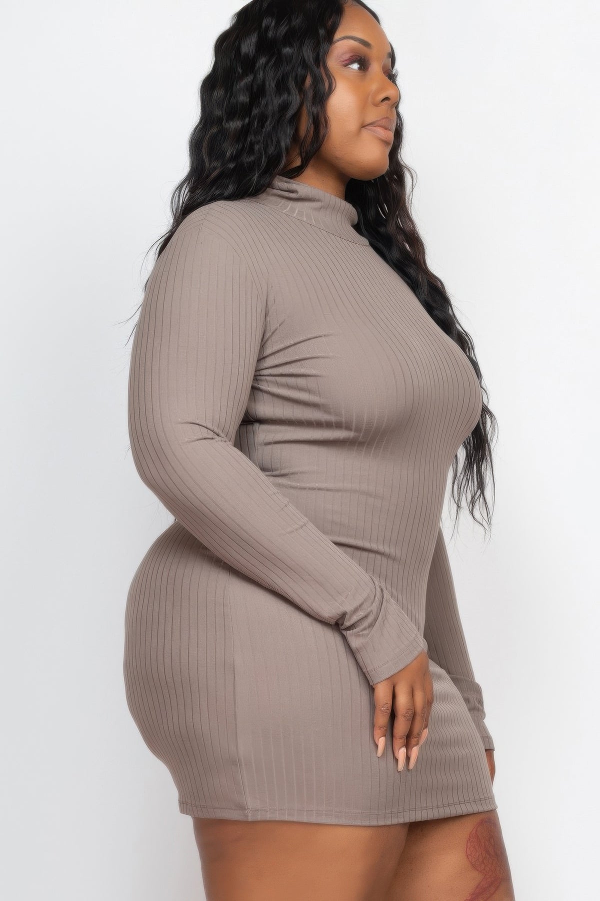 Plus Size Ribbed Long Sleeve Mock Neck Mini Bodycon Dress in taupe showing a side view of the stylish fit.